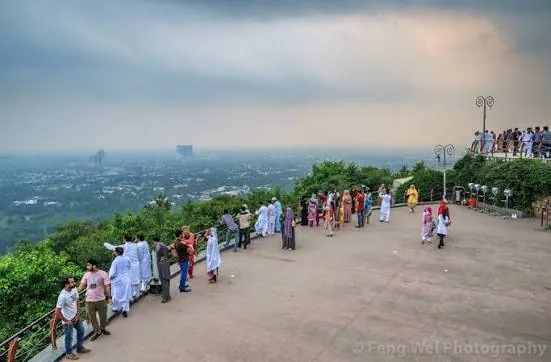 Visitors at the Daman-e-Koh viewpoint looking over Islamabad