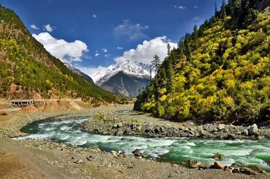 River and snow-capped mountains in Kalam valley, Swat