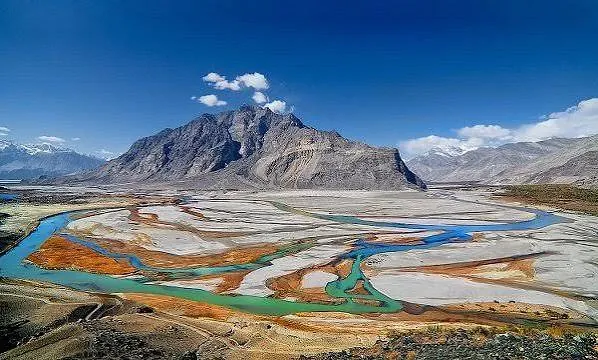 Braided Indus river channels and a rocky mountain in the Shigar valley near Skardu